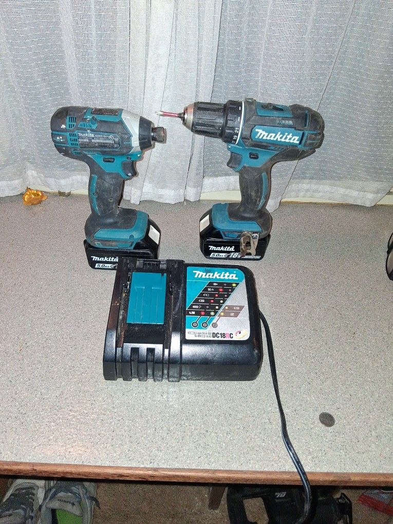 New makita drill and impact with charger