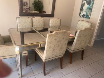 7’x 4 mirrored and gold trim table 8 chairs
