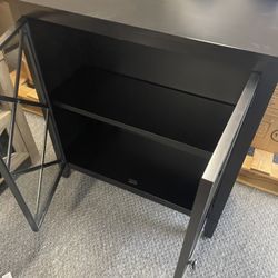 allen + roth. Accent Cabinet Black Finish Frame / 34 in • Decorative doors • Removable shelf • Black finish hardware included • Magnetic door closure 