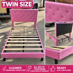 Pink twin bed frame with upholstered headboard – cleaned and ready to use