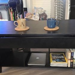 $50MOVING SALE. BLACK COFFEE TABLE W STORAGE AND SHELF SPACE