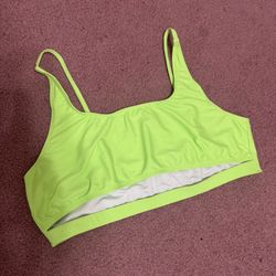 Vibrant neon lime top with a scoop neckline and thin adjustable straps. Designed for everyday swim comfort and light support. Bright neon lime color k