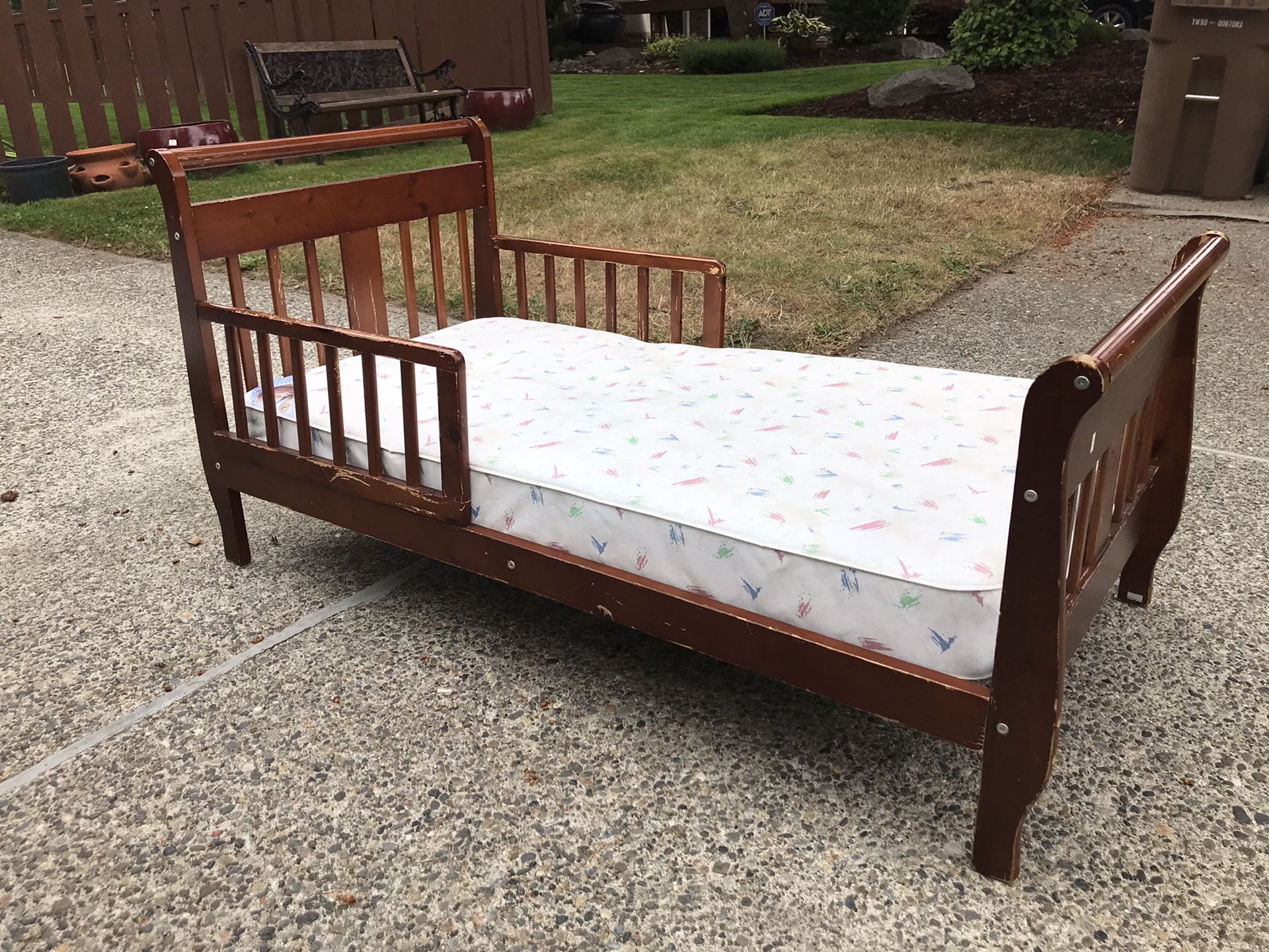Toddler bed with waterproof mattress and comforter sheet set included.