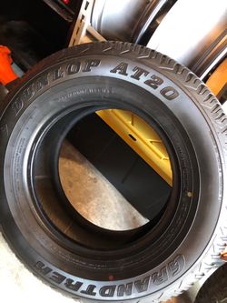 265 70 R 17” Dunlop Grandtrek AT20. New never used.  $125 have 2 …. 1 mounted on black steel spare tire/rim. Both $200
