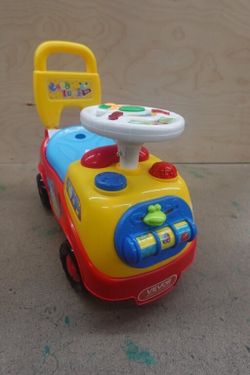 Toddler Ride-On Push Car with Musical Steering Wheel and Storage