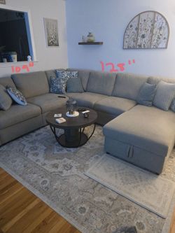 Ashley Sectional with pullup lounge sleeper storage in the lounger good condition