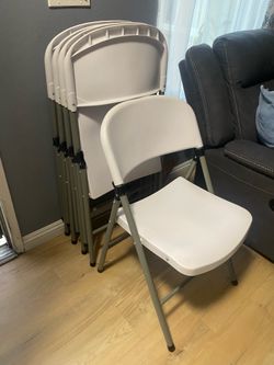5 Banquet Style white Chairs