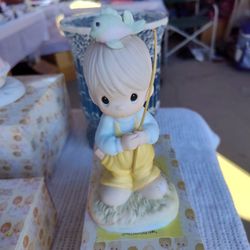 Precious Moments figurine titled "Caught Up In Sweet Thoughts Of You"
