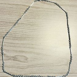 Thin silver chain with a subtle twisted link design. Lightweight and versatile. Minimal, elegant style for everyday wear.