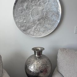 Silver vase and silver wall art