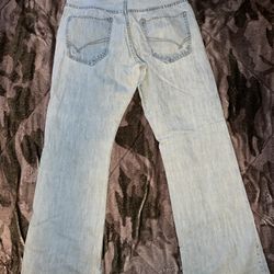 Light blue baggy ripped jeans