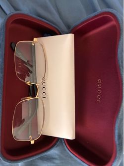 Gucci clear glasses with papers