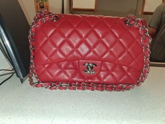 A red Chanel bag and a black Coach handbag