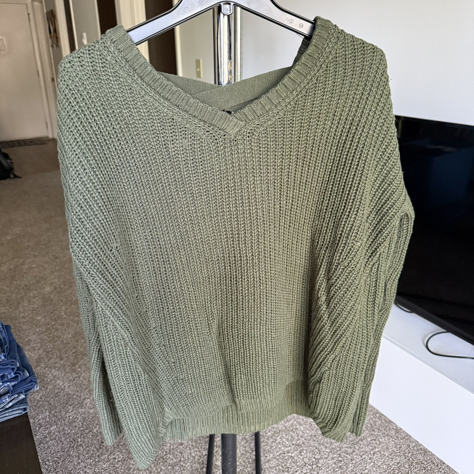 Women's V-neckline and a distinctive criss-cross strap detail on the back