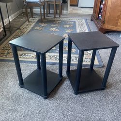 Two black side tables