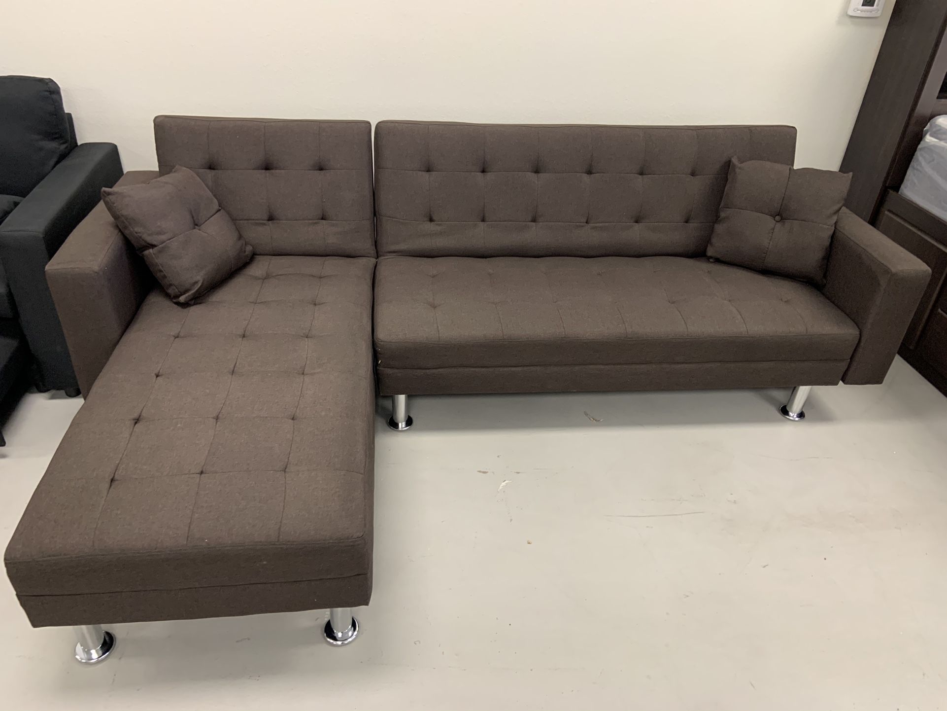 Brand New chocolate sectional,  reversible sleeper