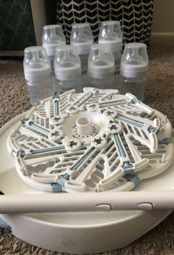 Avent baby bottles , bottle rack holder , eddie bauer shopping cart baby cover and aven steam sterilizer