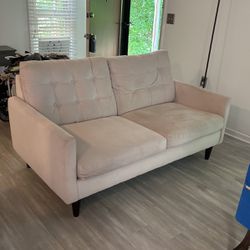 White Couch With Buttons 
