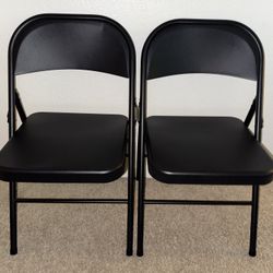 Two Black Metal Folding Chairs