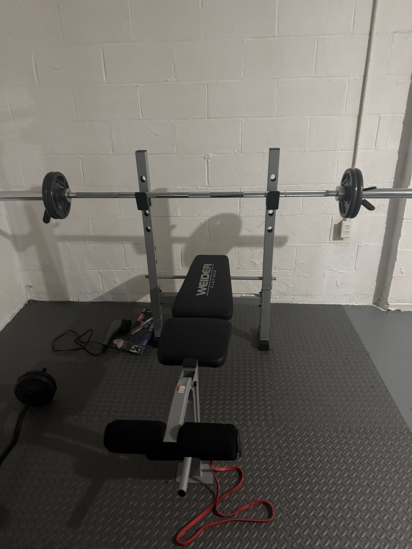 Weider Platinum Standard Weight Bench with fixed uprights and an integrated leg developer.  