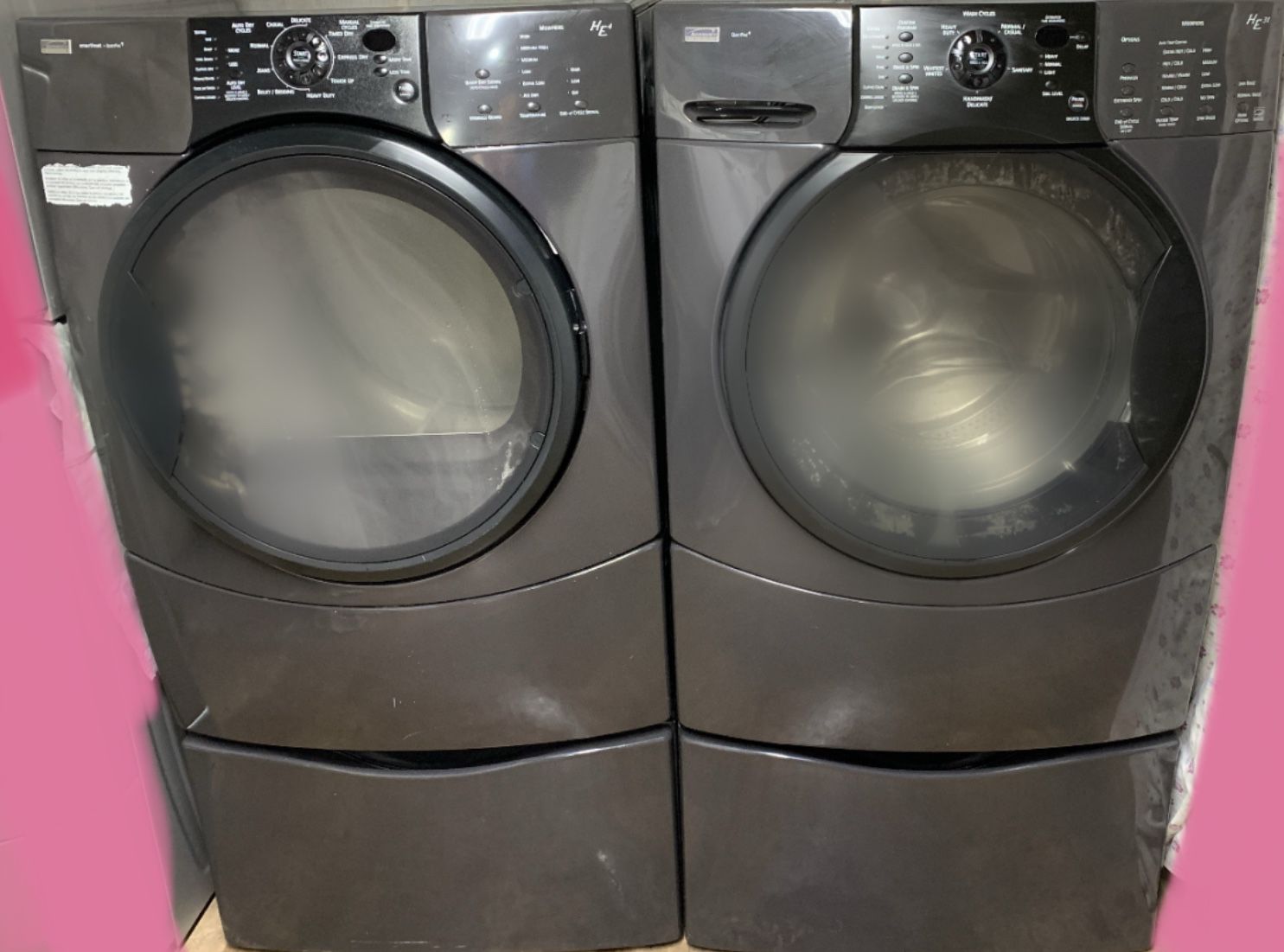 Grey Kenmore washing machine & electric dryer set on pedestals