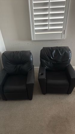 Two black leather kid chairs
