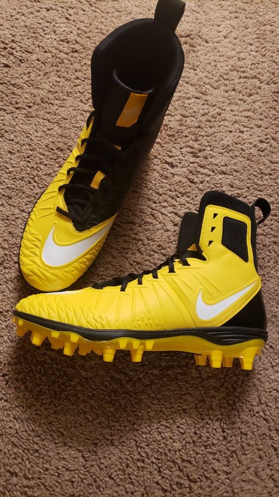 Brand new, Nike FORCE SAVAGE football cleats, size 10, hightop, black and yellow. $100