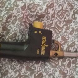 3/4 filled butane torch with attachment trigger light