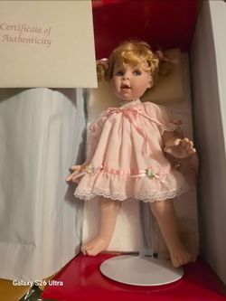 Collectible Porcelain Doll in Pink Dress
