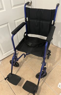Wheelchair with leg rests & seat pad