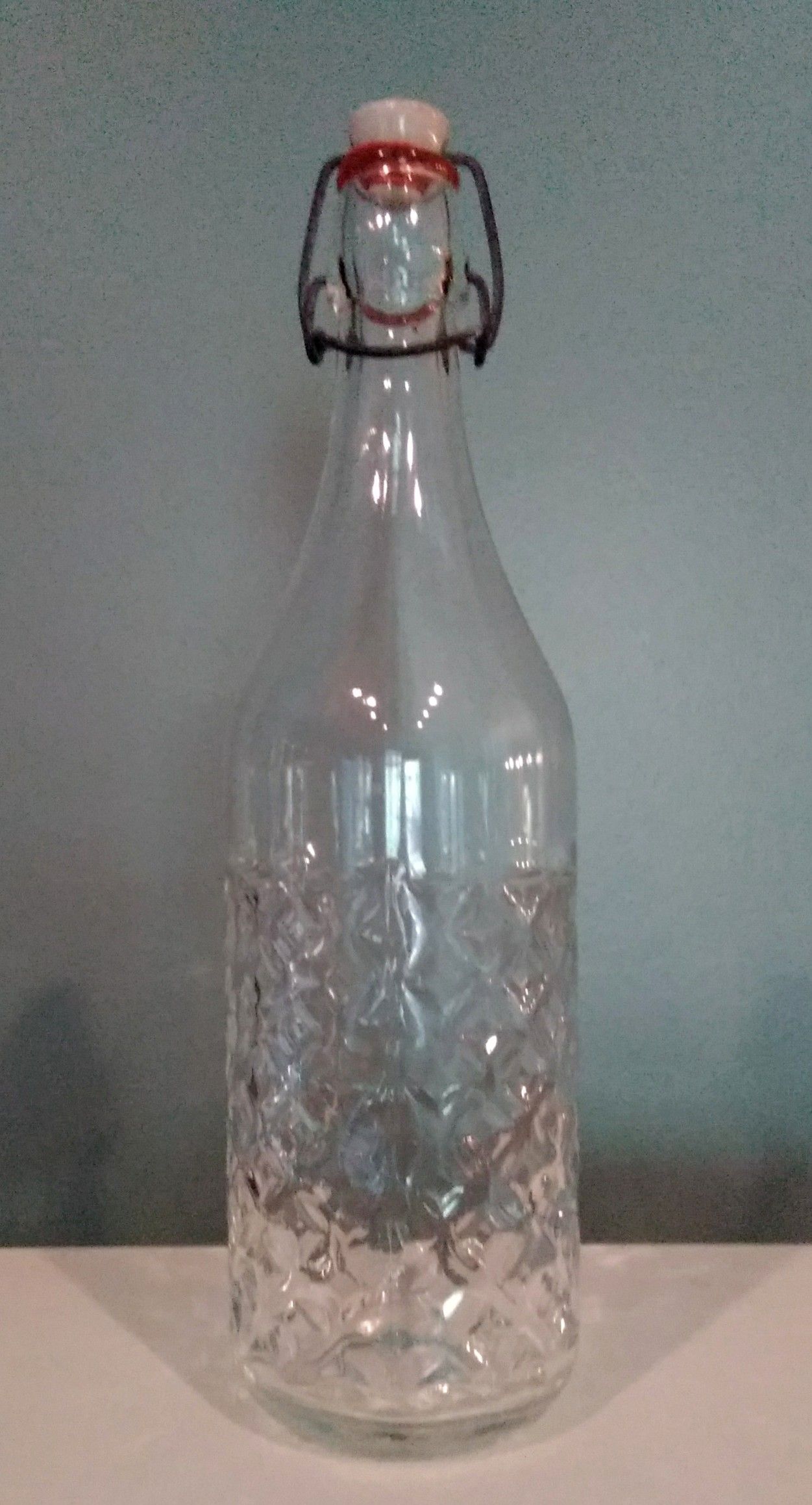 12.75" tall x 3.5" wide Textured Clear Glass Bottle with Sealed Pop Top
