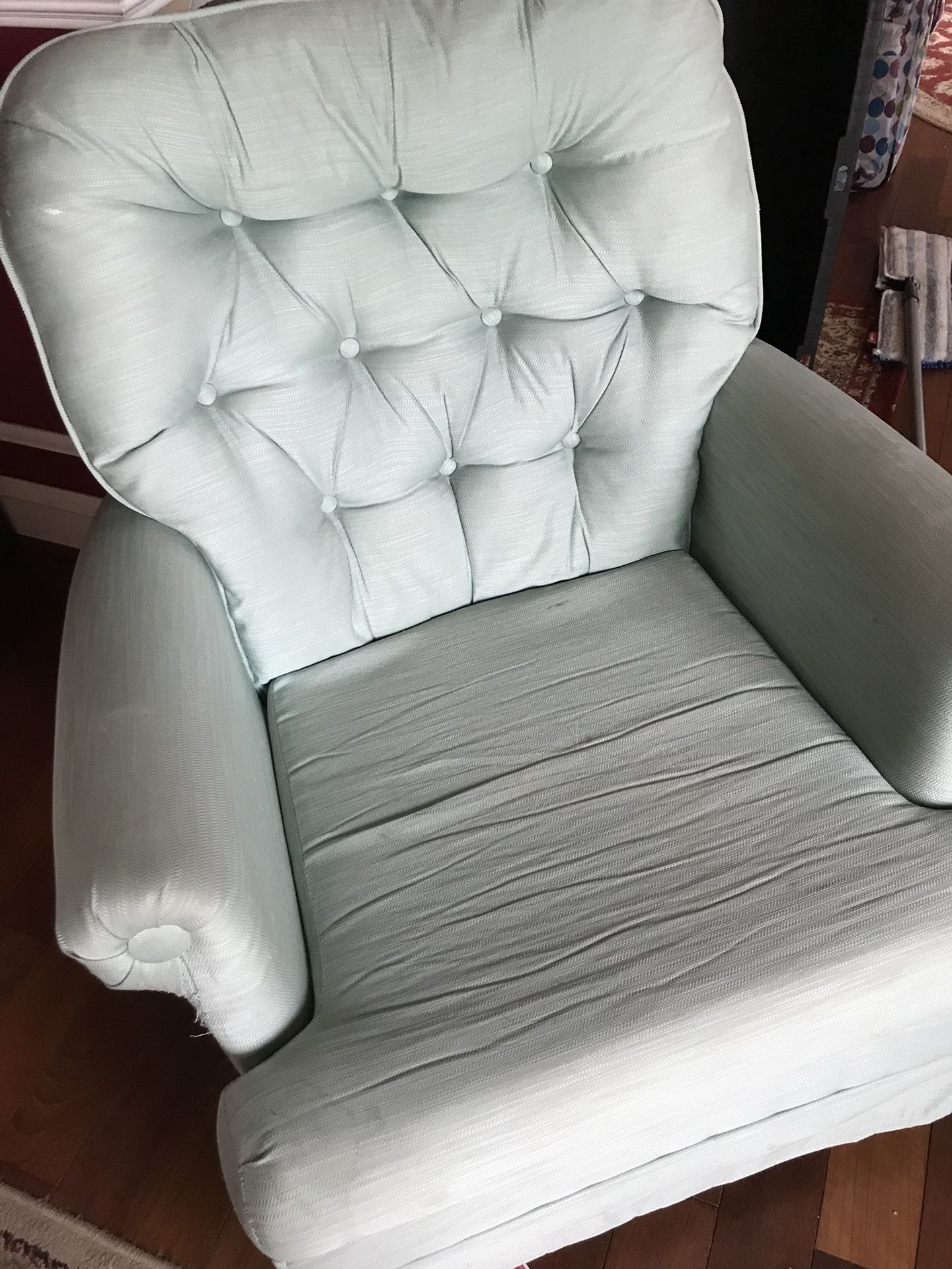 Rotating light green armchair