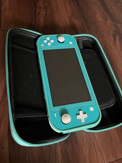 Nintendo Switch Lite + Two games