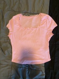 women’s pink babydoll top with lace trim and bow detail