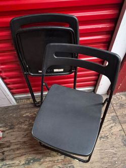 Two folding chairs (black)