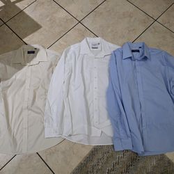 (3) mens XL Button Down dress shirts while blue beige