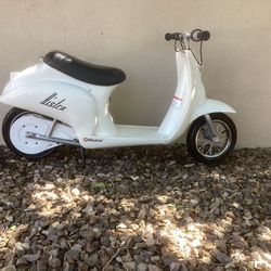 Razor Bistro electric scooter (nearly new condition).   The batteries are brand new and I am including one of the helmets pictured