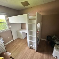 Large bunk bed with desk, closet, and shelving