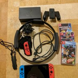 Nintendo Switch Console bundle including 3 games and Ring Fit

accessories