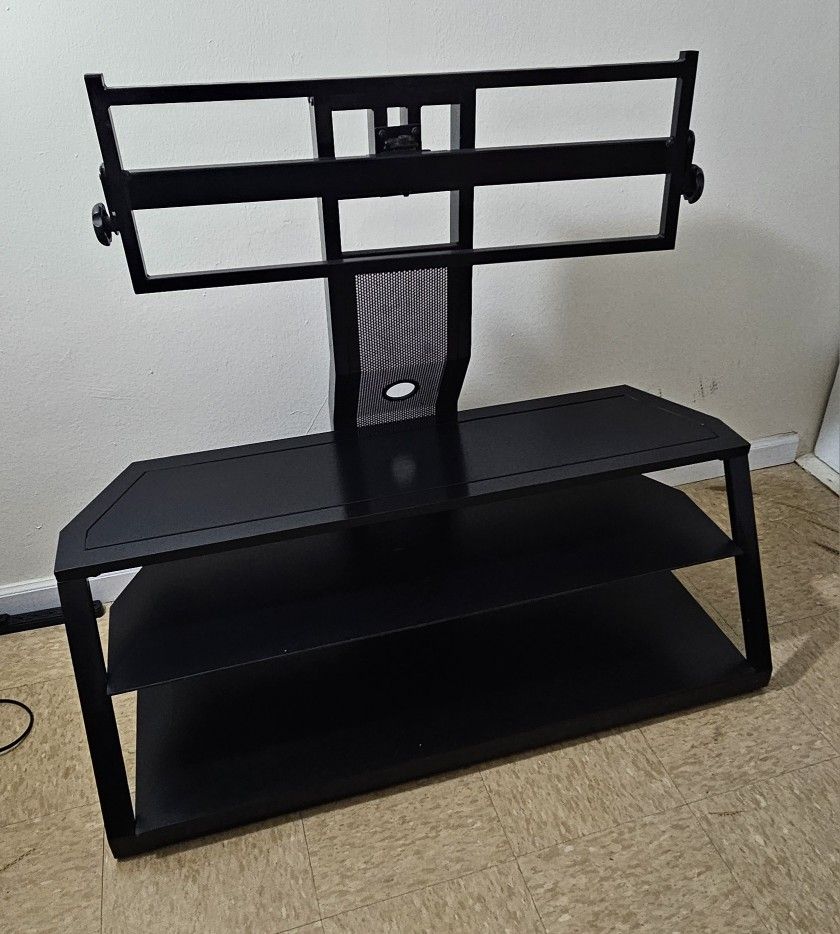 Three-tier metal and glass TV stand with a movable neck mount. Sturdy, modern, and in great condition.