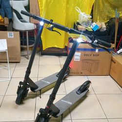 QINGOR FOLDING ELECTRIC SCOOTER MOTOR 350W POWER. SPEED MAX 19MPH, RANGE 25 MILES. SOLID TIRES. FRONT SUSPENSION.