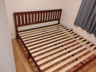 Wooden bed frame with headboard. King size.
