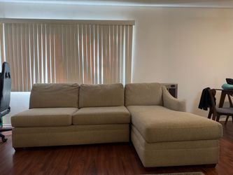 Two Piece tan “L” Shaped Sectional