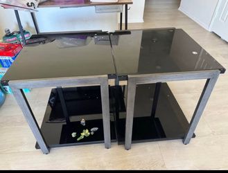 Coffee table set has two small and one large table