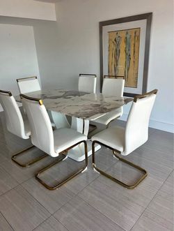 Marble dinner table with leather chairs