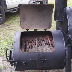 Reverse flow BBQ Pit Texans and Astros emblems holds 6 briskets