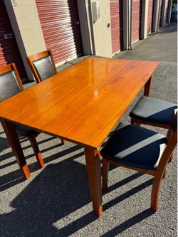 Wooden table and four chairs