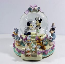 Retired Disney wedding snow globe