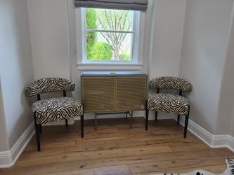 Zebra dining chairs zebra hide rug and cabinet
