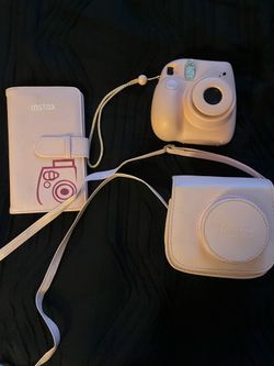 Instax Polaroid Camera with carrying case and pgoto album